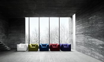 Colorful couches in a grey room